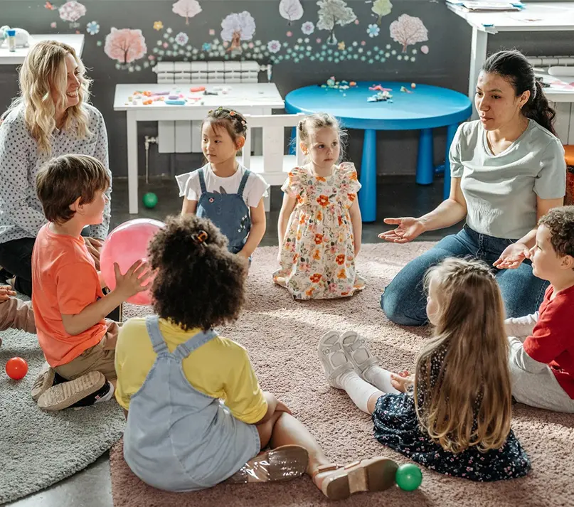 Adults With Kids In A Circle Square