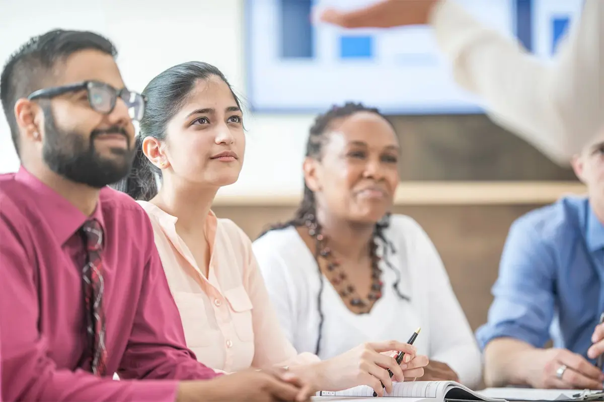 Adults Listening During A Class