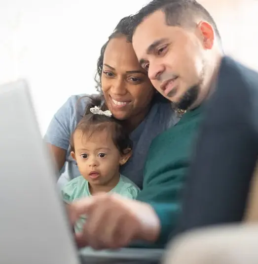 2 Adults Sitting With Infant