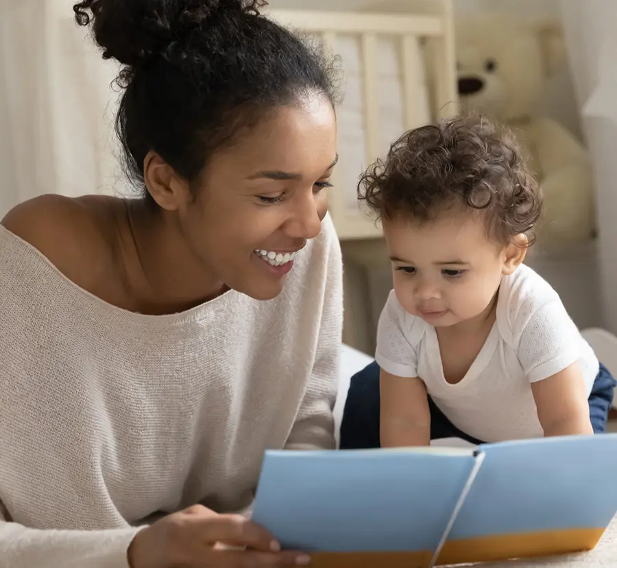 Adult Reading To Infant